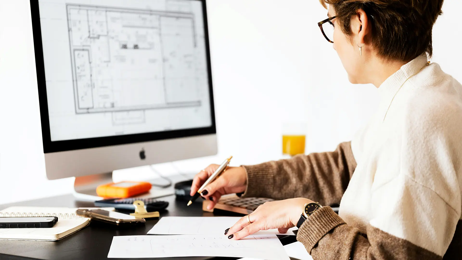 Female working on a desktop planning home extensions